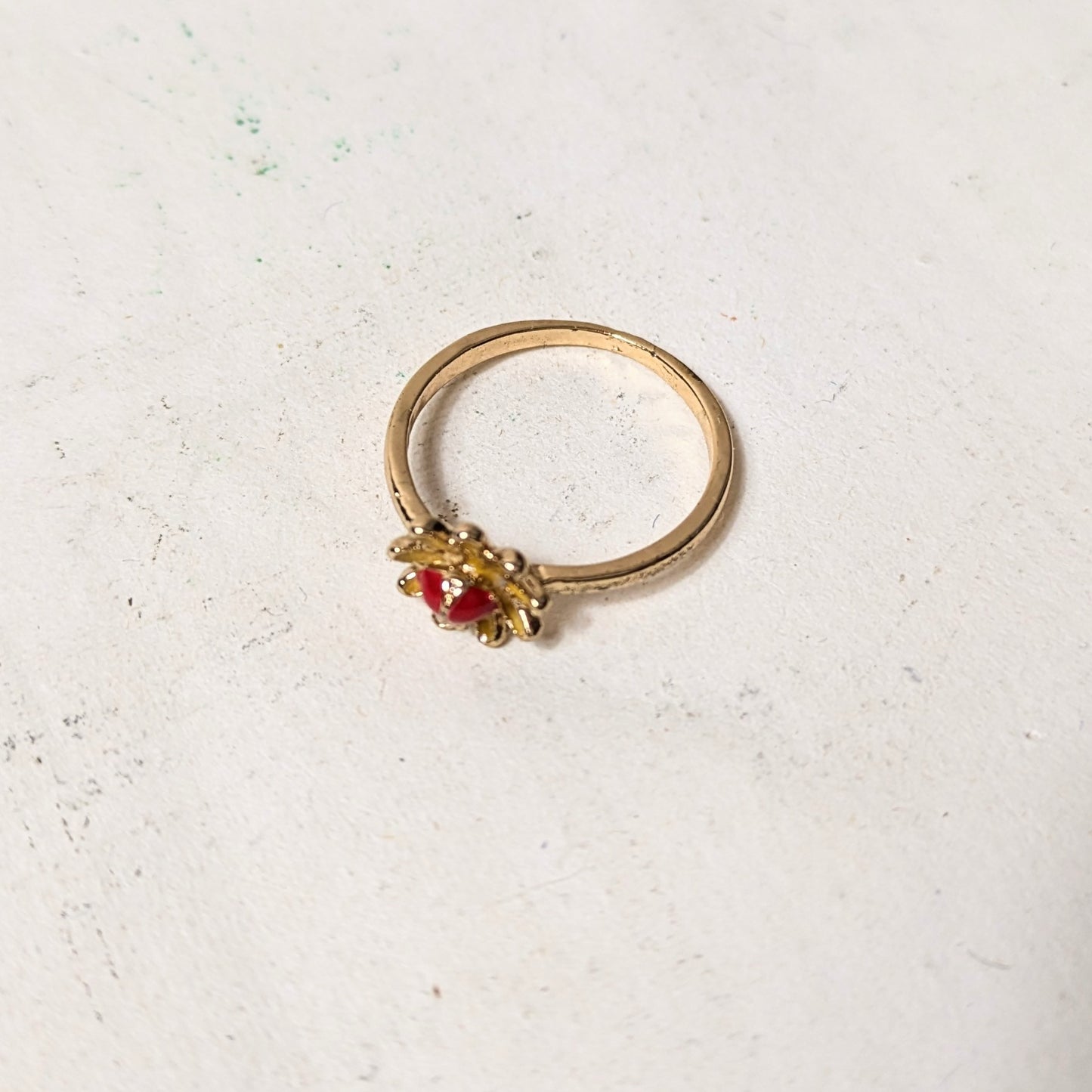 Ring red stone in flower