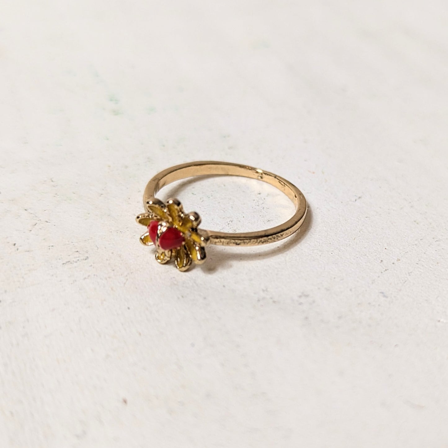 Ring red stone in flower