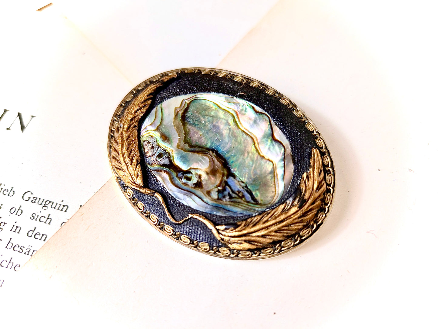 Brooch with shell inlay