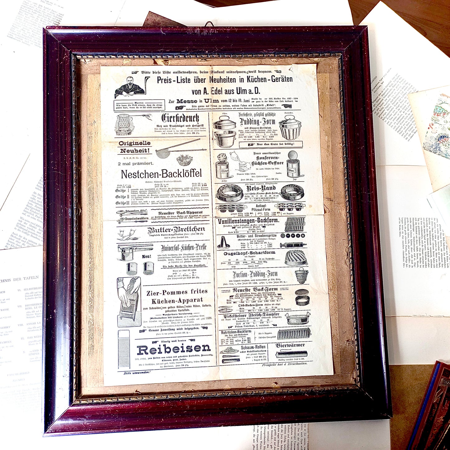 Framed advertisement for kitchen utensils