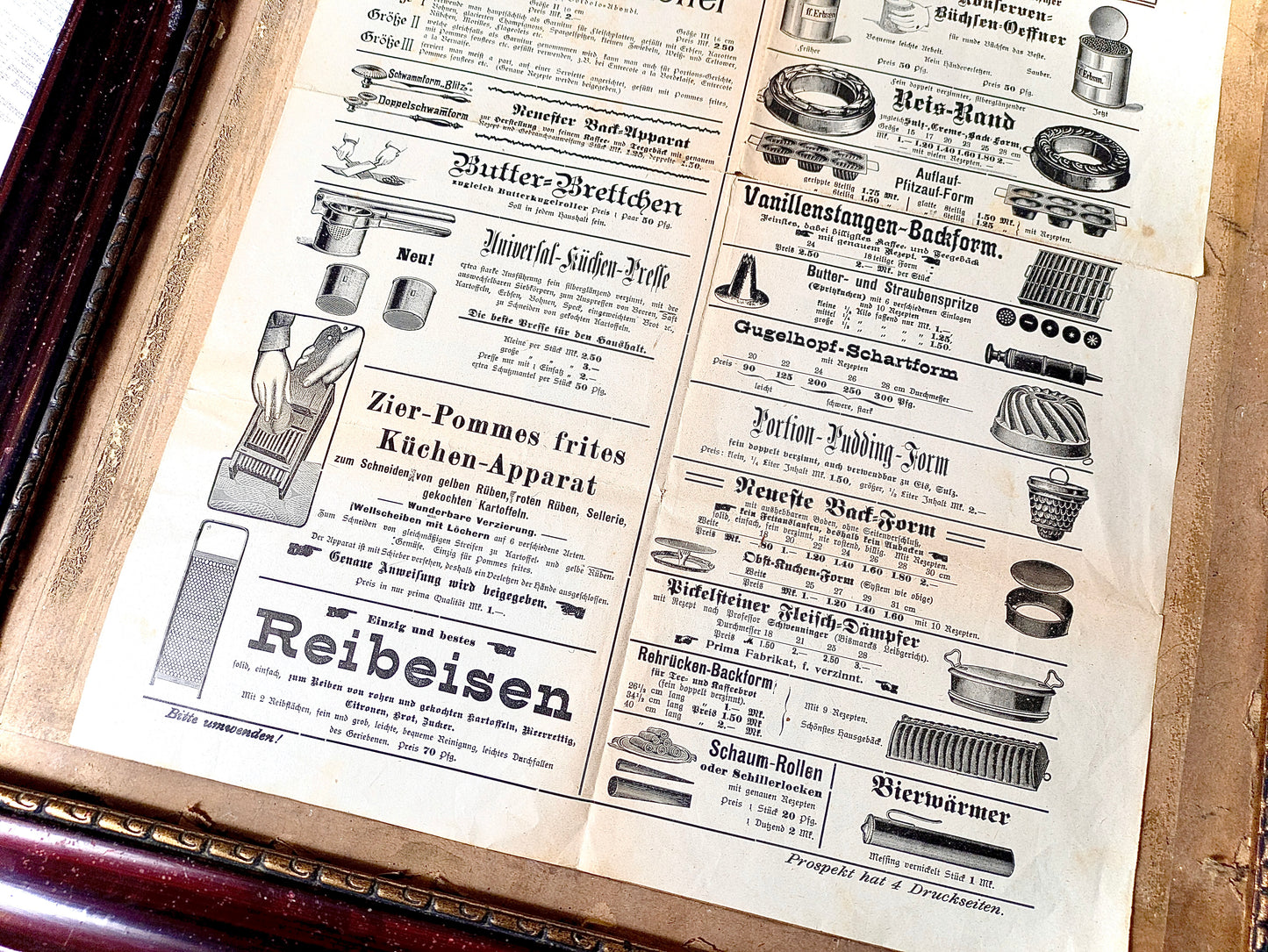Framed advertisement for kitchen utensils