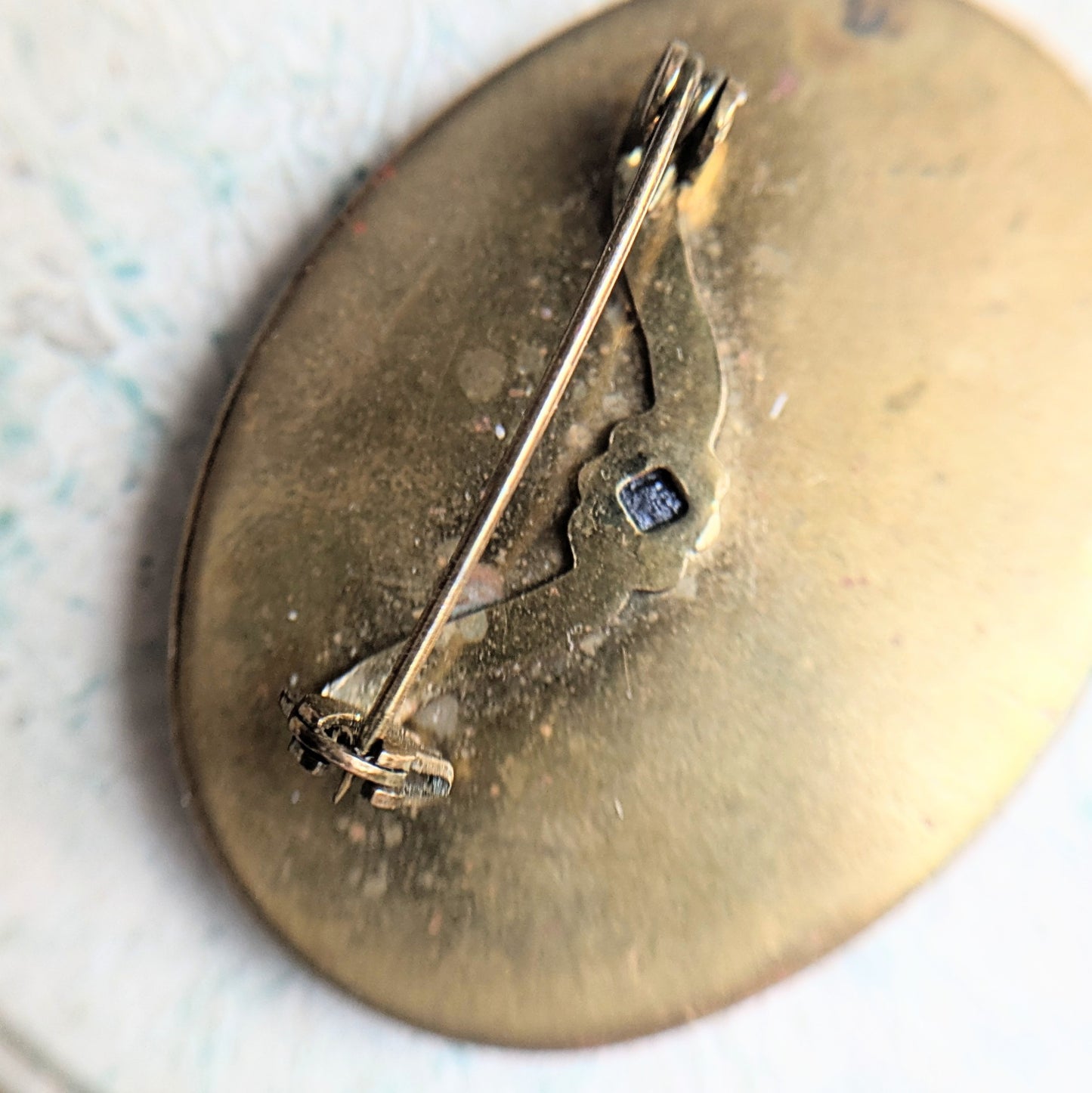 brooch with hand
