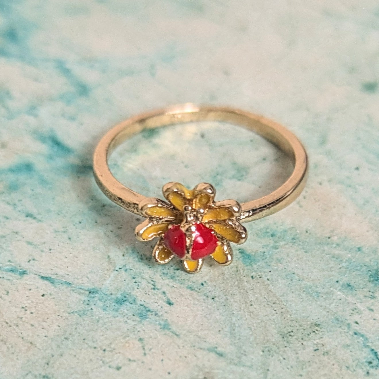 Ring red stone in flower