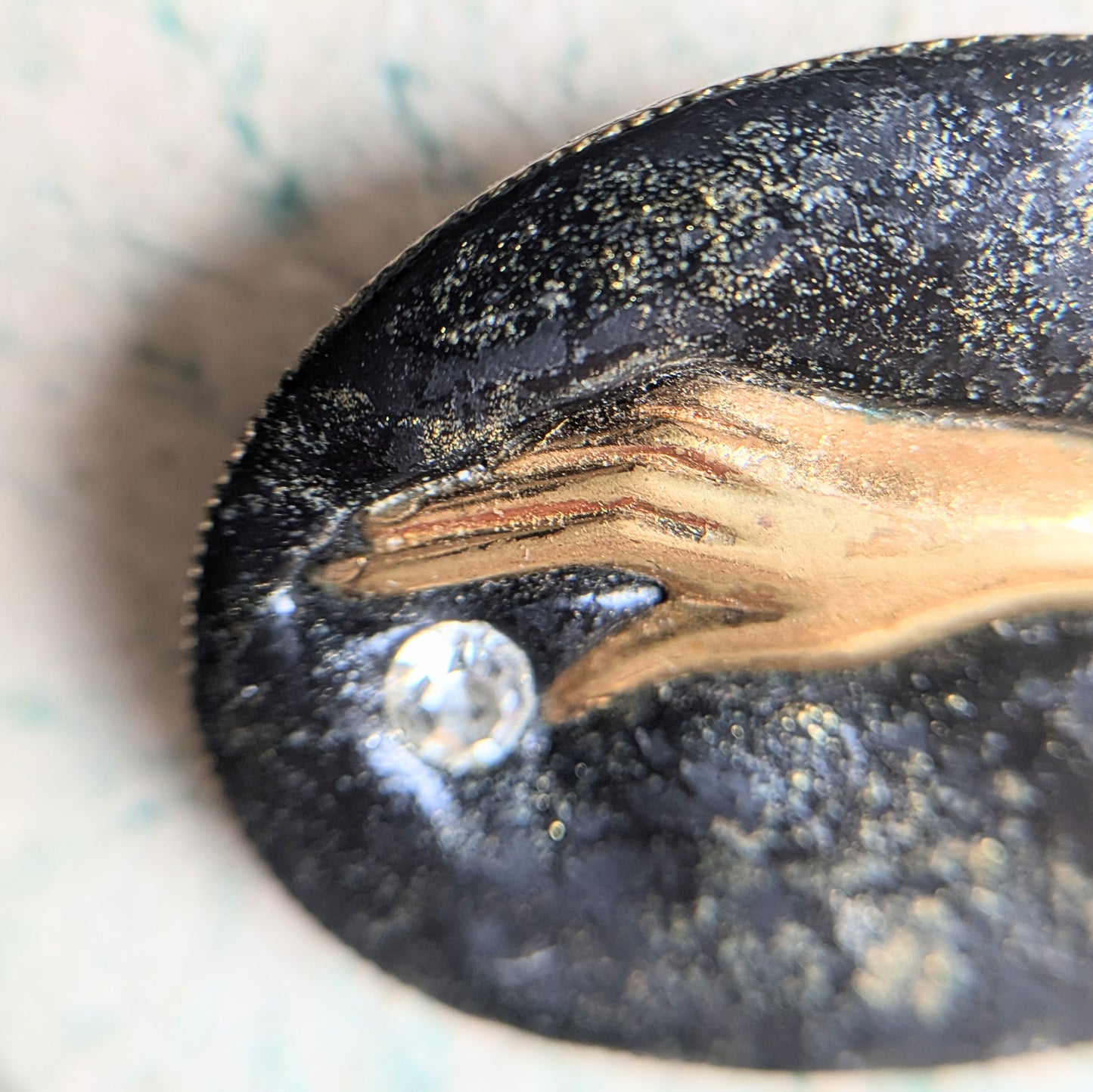 brooch with hand