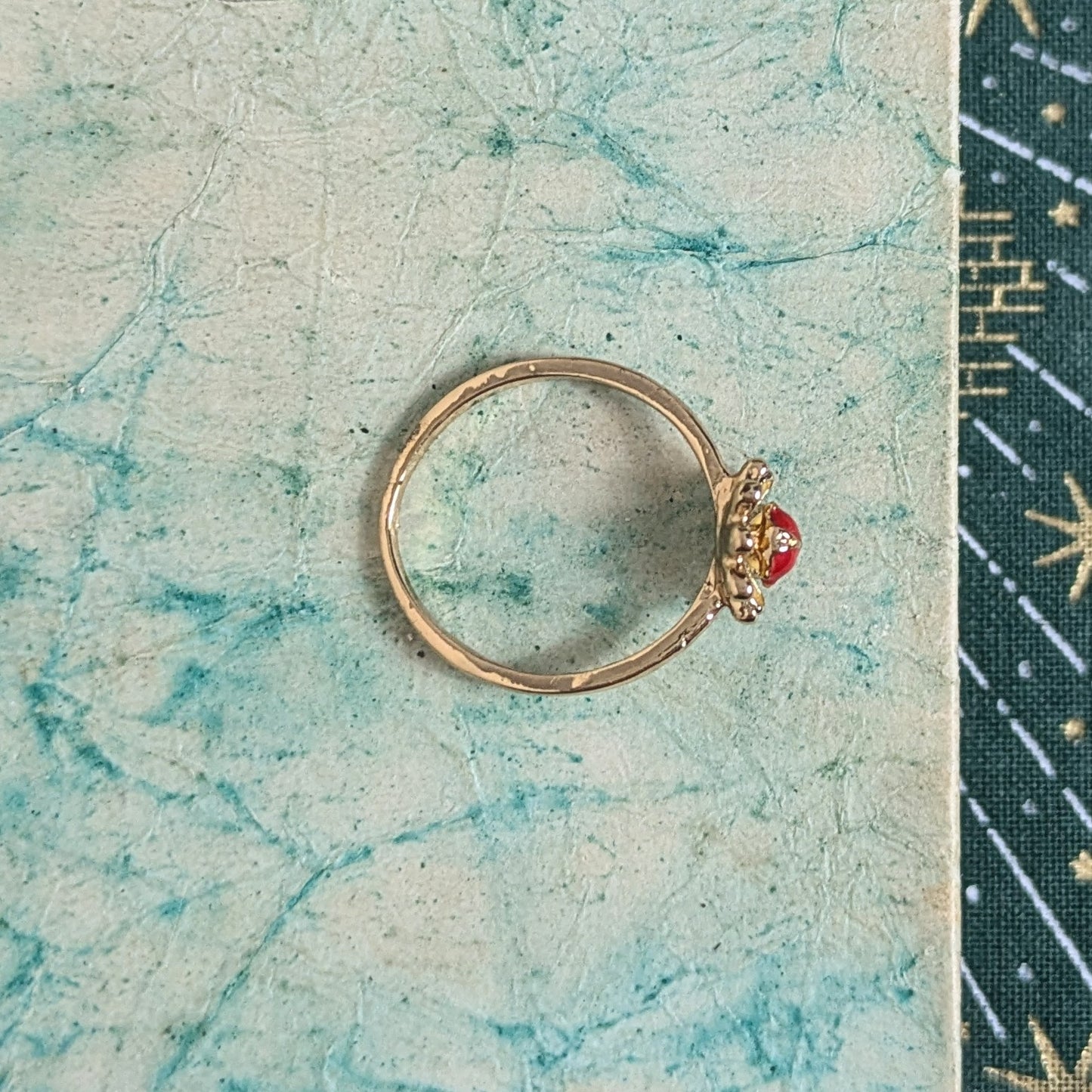 Ring red stone in flower