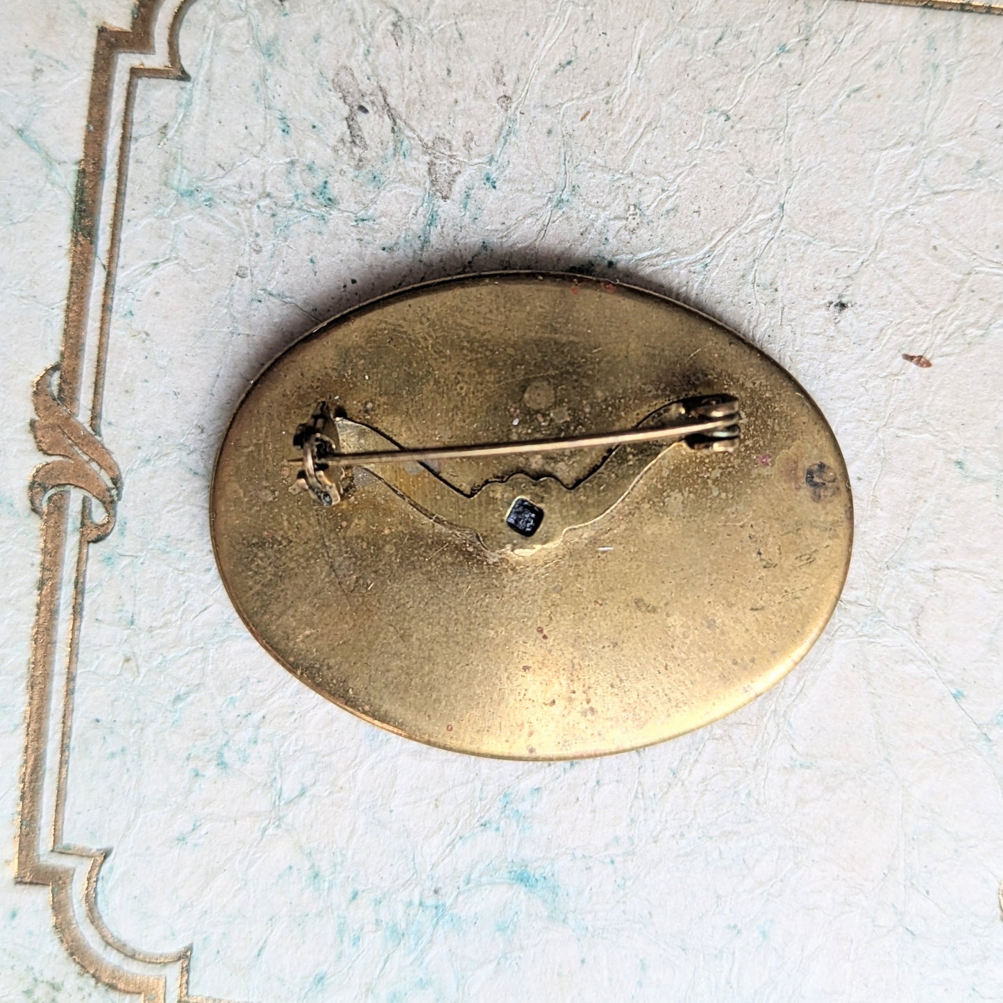 brooch with hand