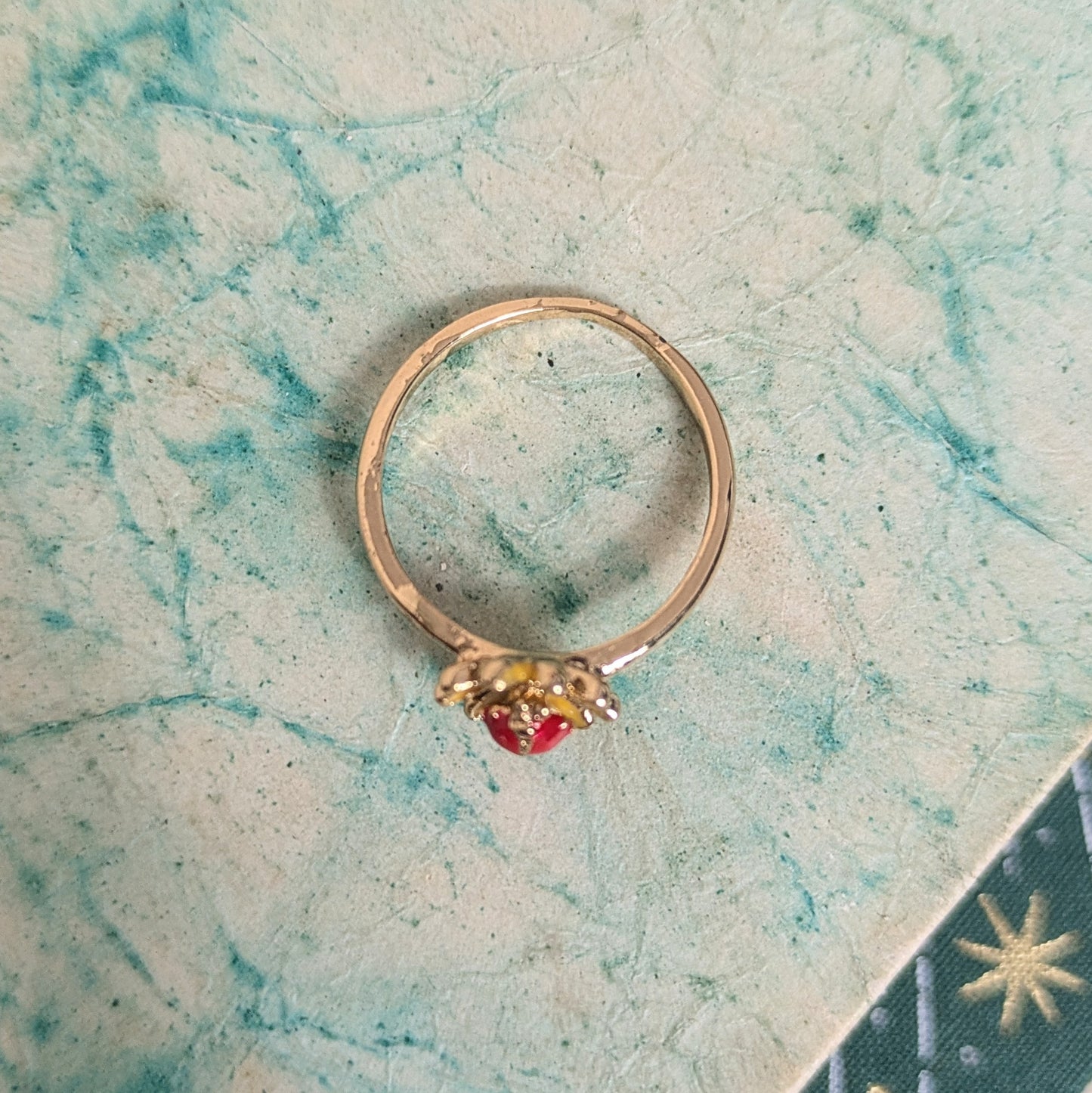 Ring red stone in flower