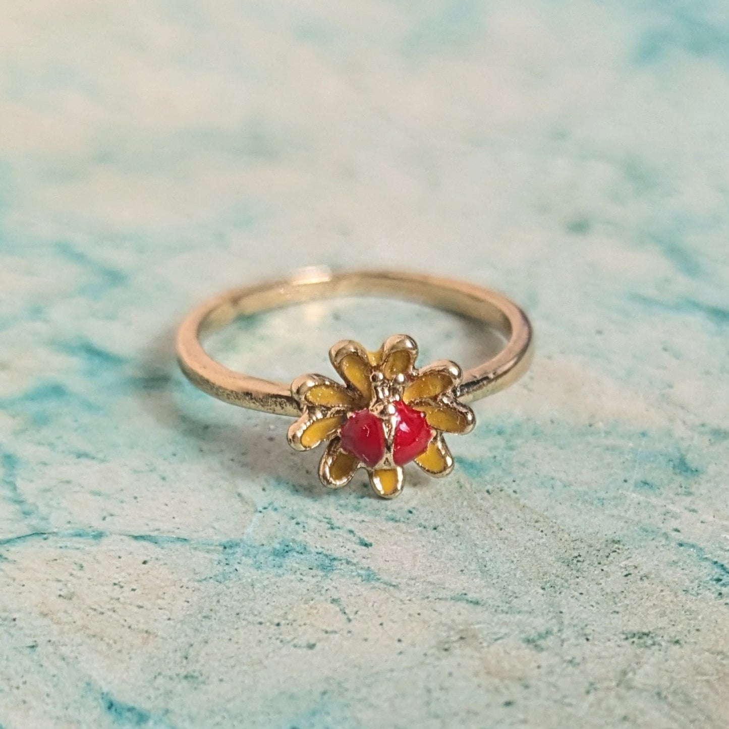 Ring red stone in flower
