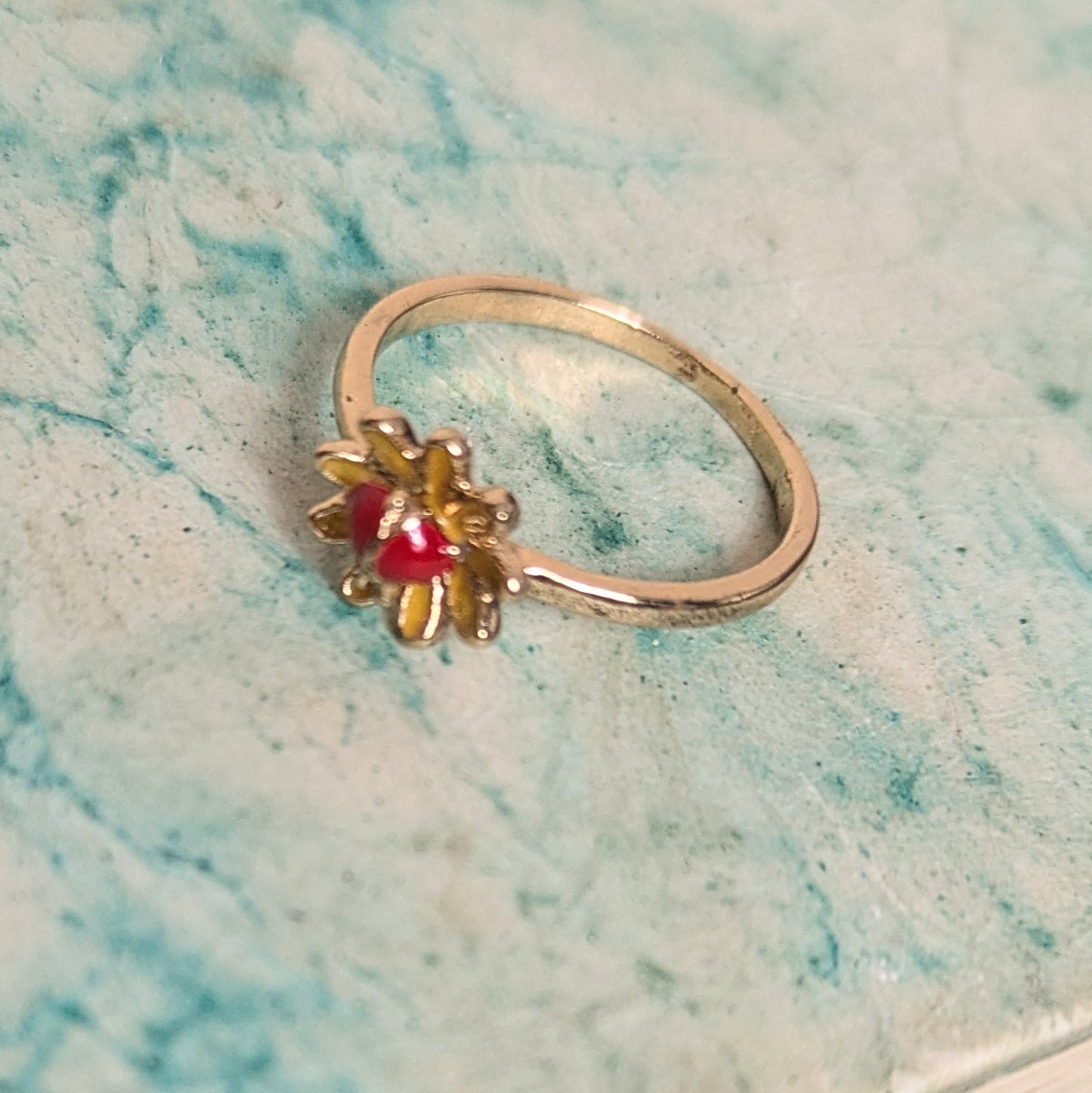 Ring red stone in flower